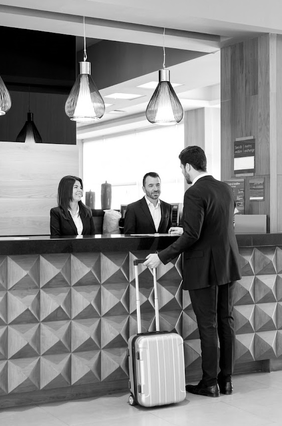 Restaurant kitchen staff following compliance checklists